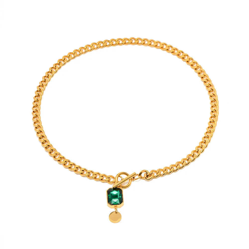 Gold electroplated titanium steel necklace with geometric pendant and emerald zircon stone