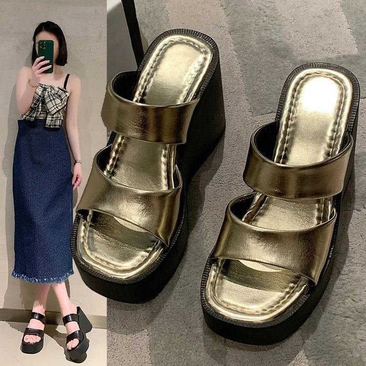 Women's black wedge platform slippers with a square toe and PU upper material.