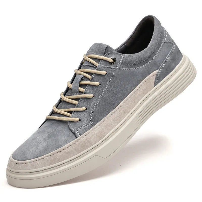 Men's grey casual leather skate shoes with low-top design and round toe on a rubber sole.