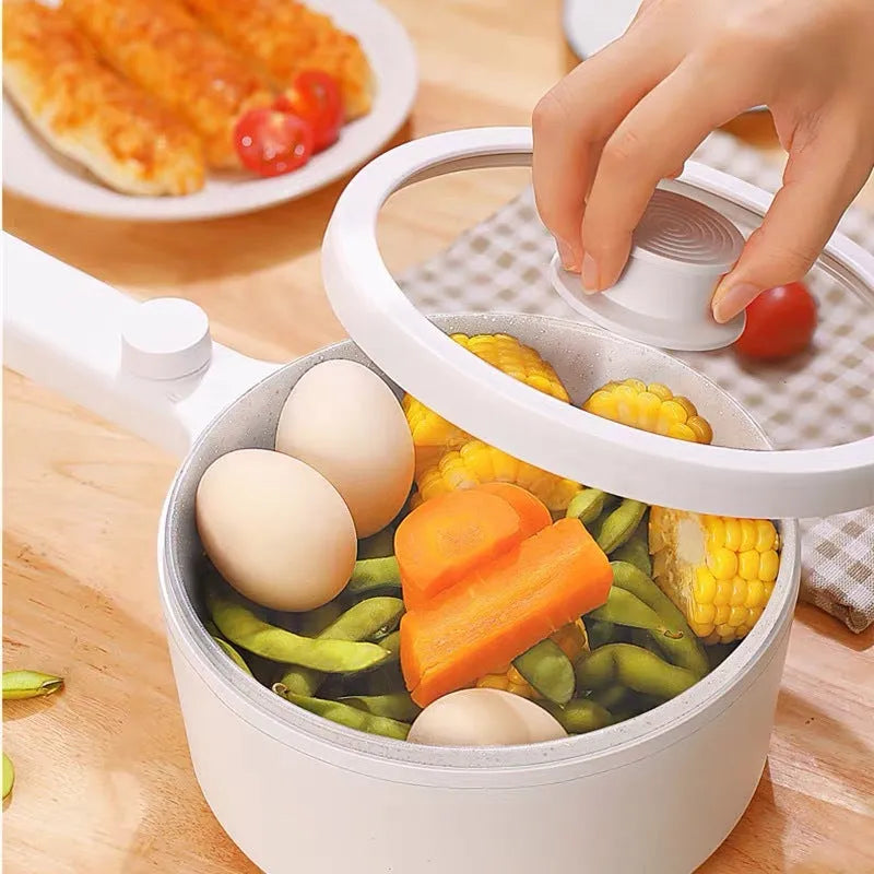White mini electric cooking pot with 600W power and multiple cooking functions including boiling, steaming and frying
