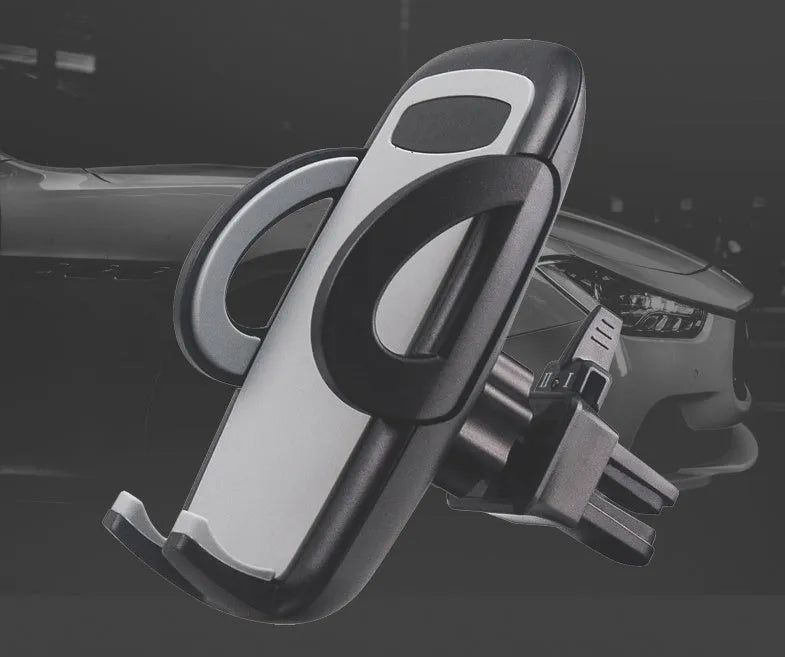 Black plastic car air vent phone holder attached to vehicle air conditioning outlet with mobile phone secured