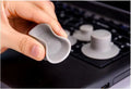 Four grey durable plastic laptop cooling pads, two large and two small, placed on a desk surface.
