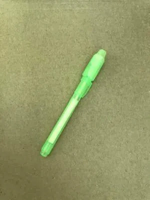 Educational drawing pad with light-accumulating coating, flashlight marker, and alphabet template for children aged 4-6.