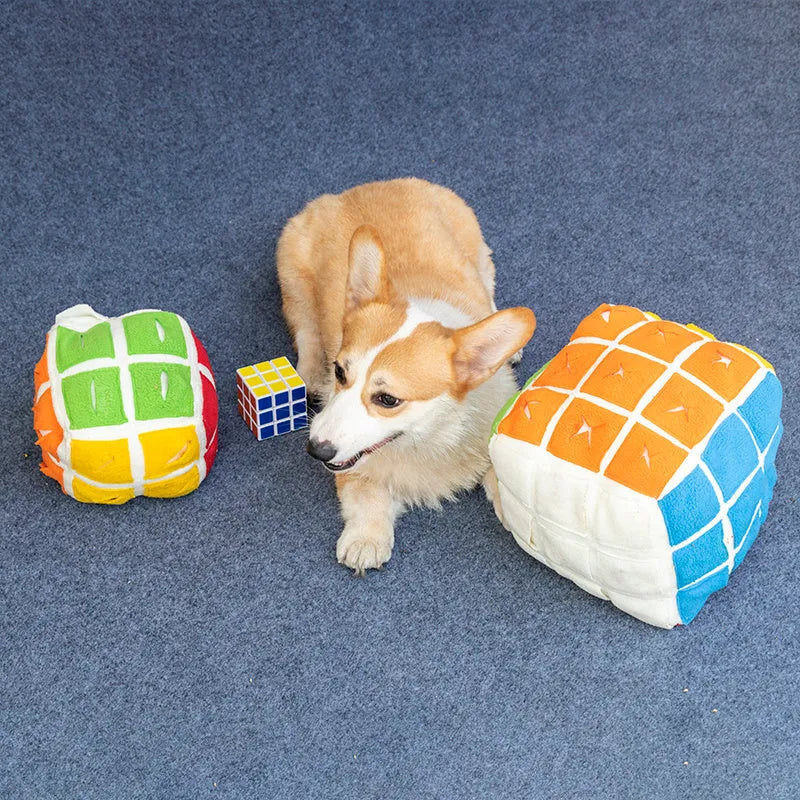 Pet Rubik's Cube sniffing toy in polar fleece fabric with treats visible, 15cm cube on a light background