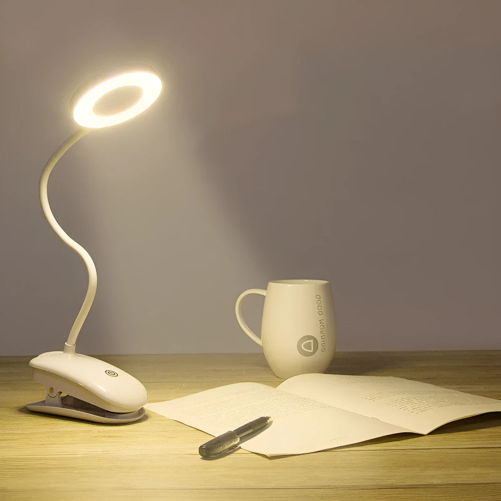 White rechargeable clip-on desk lamp with a modern plastic shade and touch switch