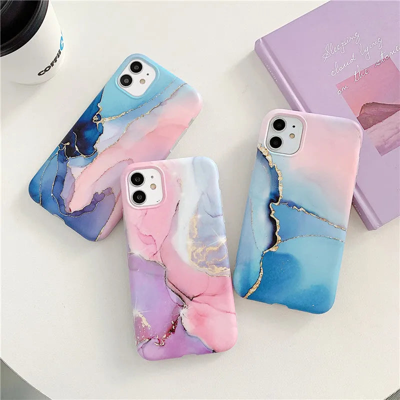 Cartoon marble pattern TPU back cover case for iPhone on a blue powder background.