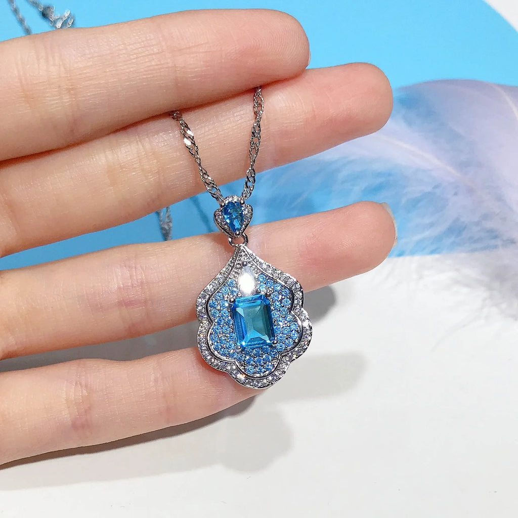 Sea blue geometric copper pendant with aquamarine topaz sky mirror appearance