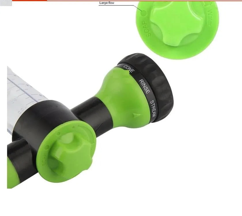 Green high-pressure foam spray gun for car washing with adjustable nozzle and attached water pipe.