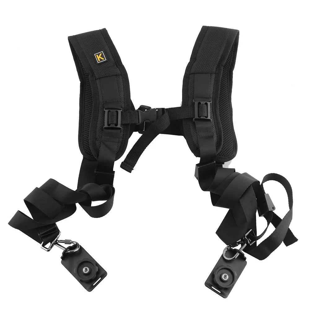 Black professional dual SLR camera shoulder strap with thick padding, shown holding two cameras.