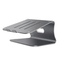 Silver aluminium laptop cooling stand with rotary base on a wooden desk, elevating a laptop.