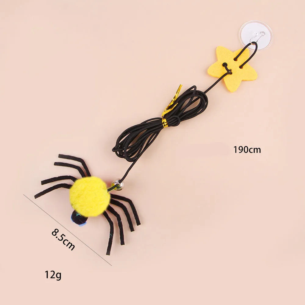 Red or yellow cat toy hanging from door with elastic rope, feathers, bells and spider attachment