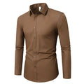 Loose fit long sleeve linen shirt on a hanger, shown in a light colour.