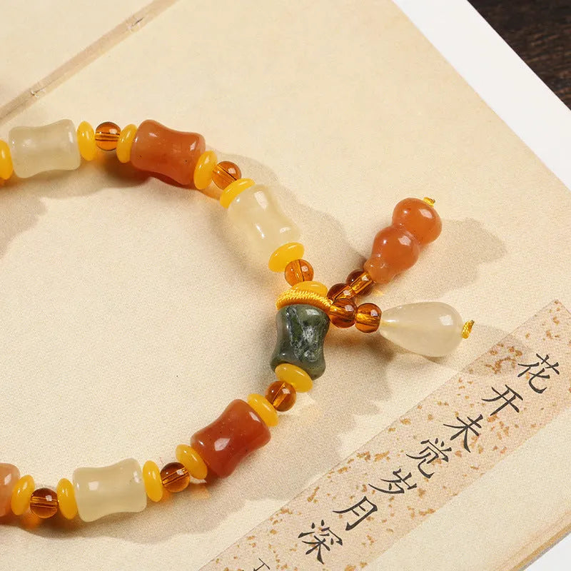 Natural Jinsi Jade small bone beads bracelet with geometric shape and auspicious patterns.