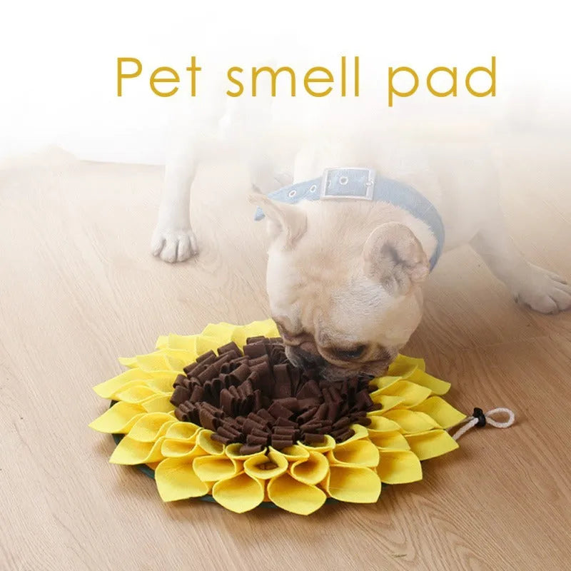 Yellow sunflower-shaped dog snuffle mat with rope and buckle attachment for slow feeding