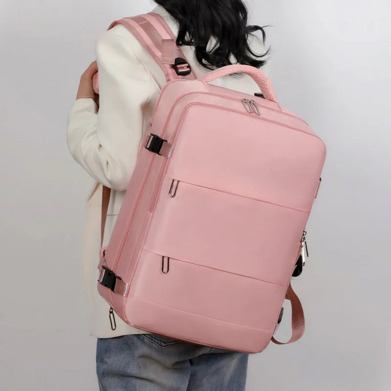 Large purple travel backpack with multiple compartments and an air pillow strap system.