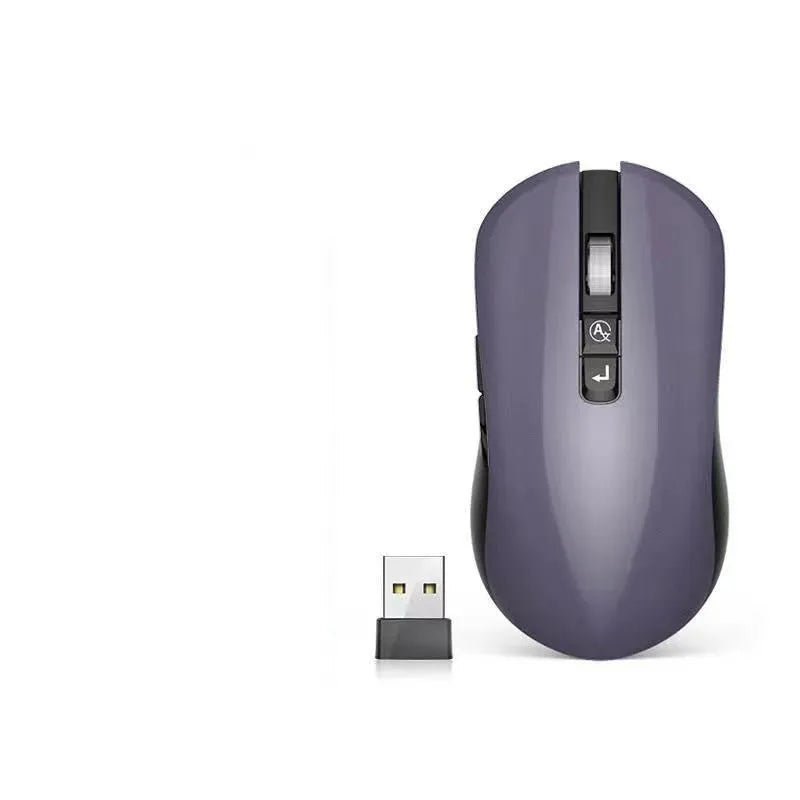 White wireless computer mouse with seven buttons on a desk, showing the USB receiver and voice transcription icon on screen.