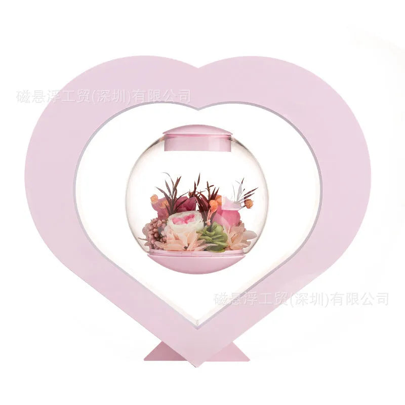 Pink preserved rose ornament with LED lights on a base, with optional audio Bluetooth for music.