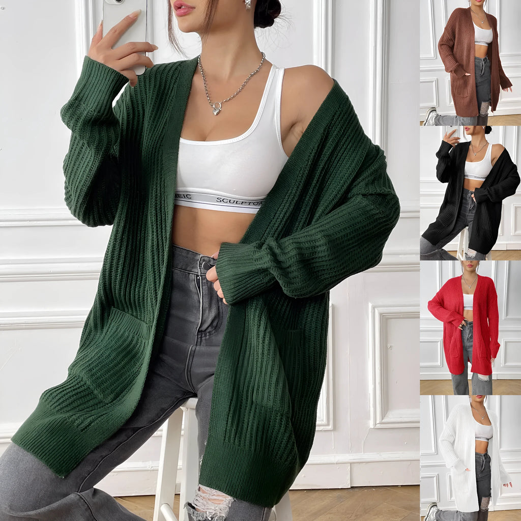 Dark green loose women's cardigan with two pockets and long sleeves.