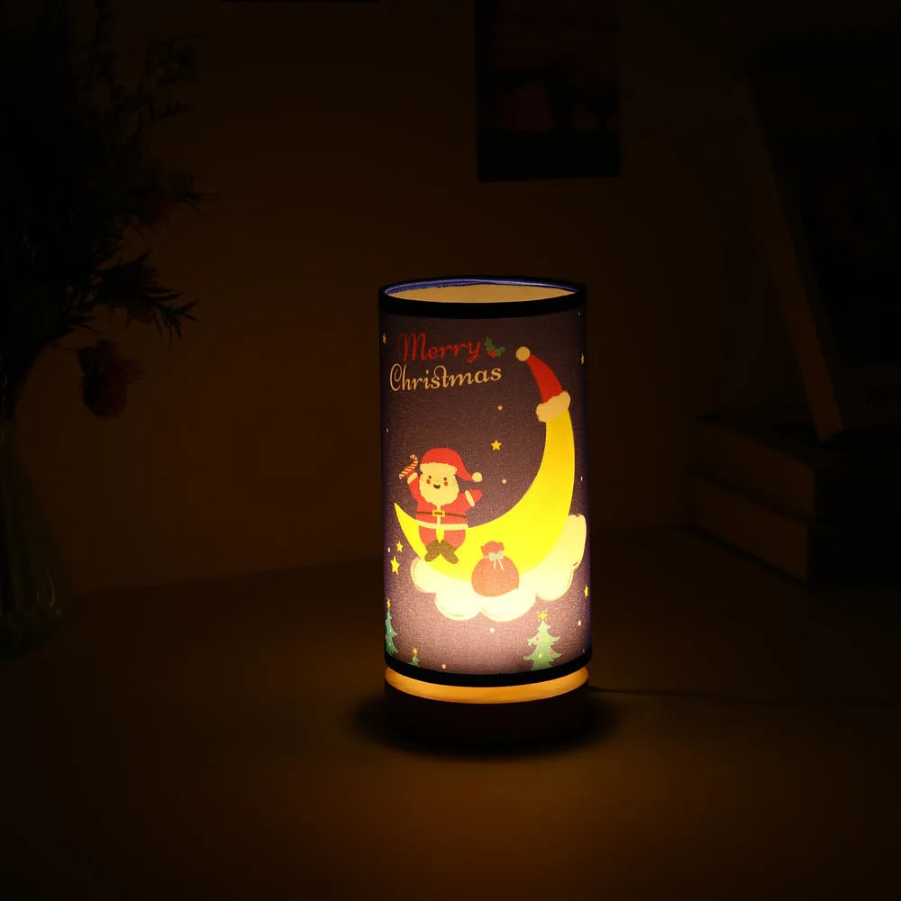Moon and Santa Claus themed LED night light with a bamboo base and USB plug cable.