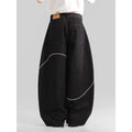 Black straight leg denim trousers with micro elastic waistband and zip fly placket detail