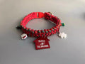 Green rope dog leash with a P chain section and a metal release buckle, held in a hand.