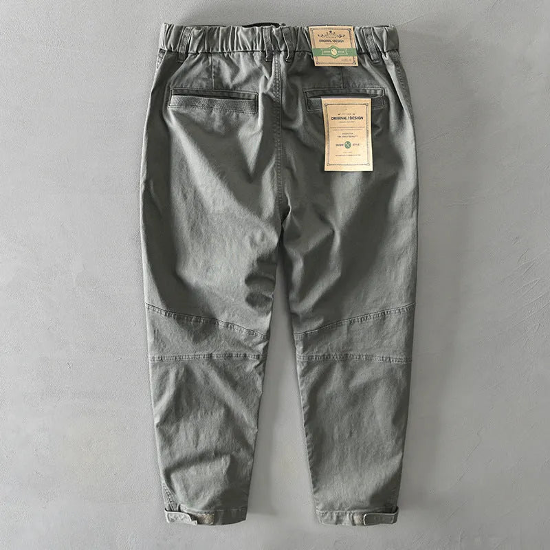 Man wearing khaki cotton elastic casual Japanese overalls with a loose fit.