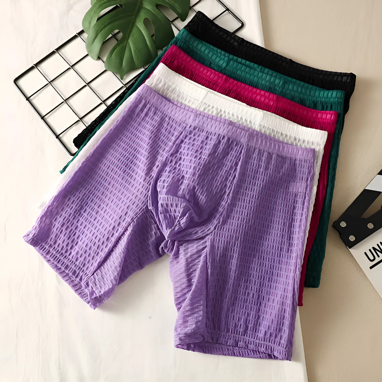 Men's solid colour lace boxer shorts with a hip lifting shaping design
