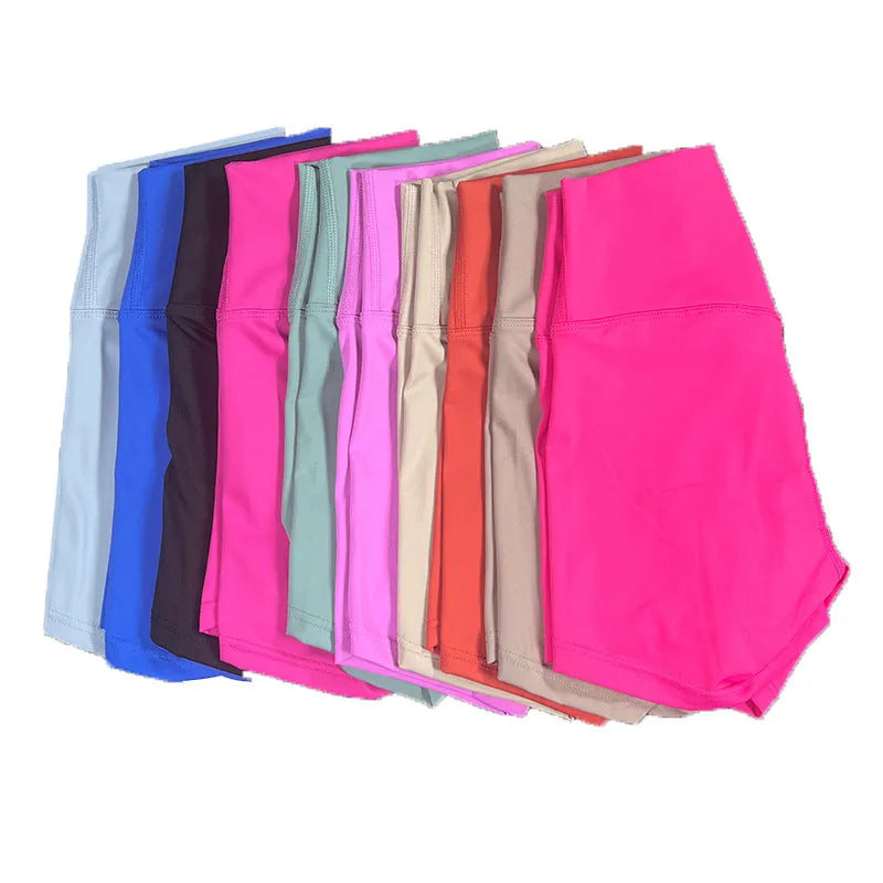Women's high-waisted yoga shorts in quick-dry nylon, shown in a selection of available colours.
