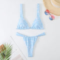 Women's floral print bikini swimsuit set in blue, with bra top and briefs.