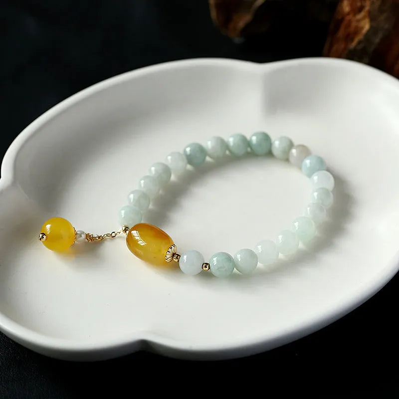 Women's ethnic geometric bracelet with hanging red agate beads and 14K gilded finish