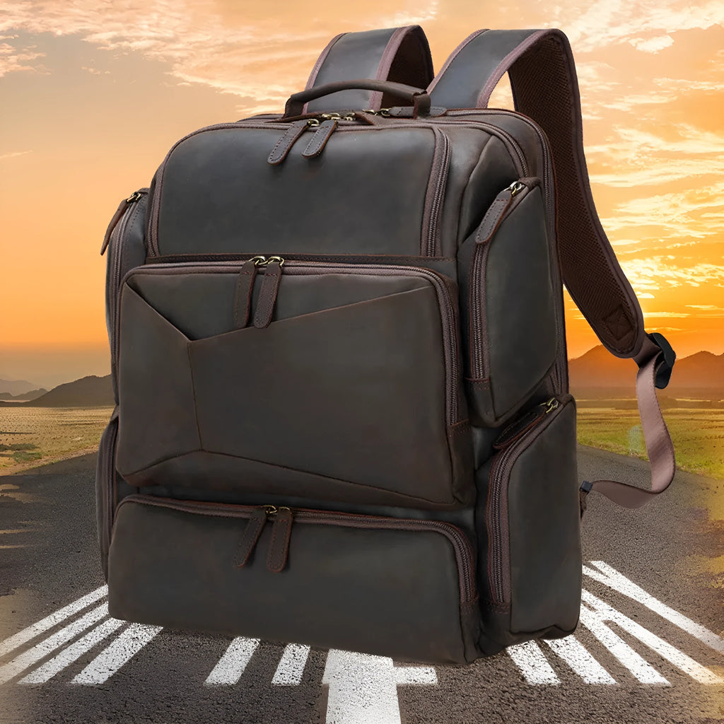 Dark brown genuine leather backpack for men showing embossed texture, double straps, and open compartments.