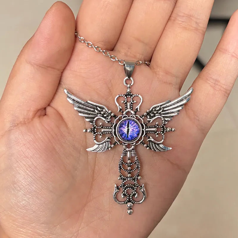 Geometric devil wings and cross alloy pendant necklace in blue on a silver chain.