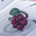 Geometric black gold plated flower ring with red simulated corundum stones for women.
