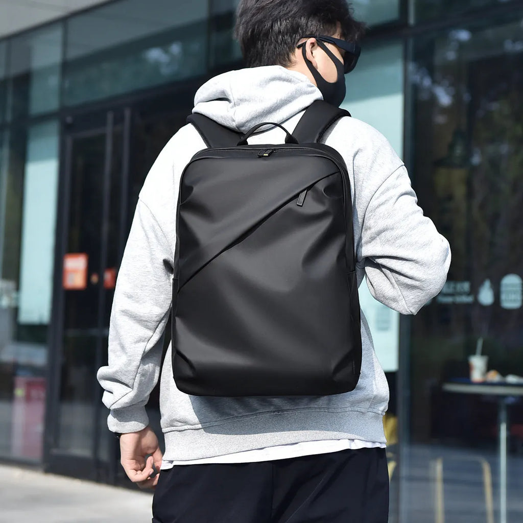 Large black waterproof backpack made from PU leather with sewing thread detailing