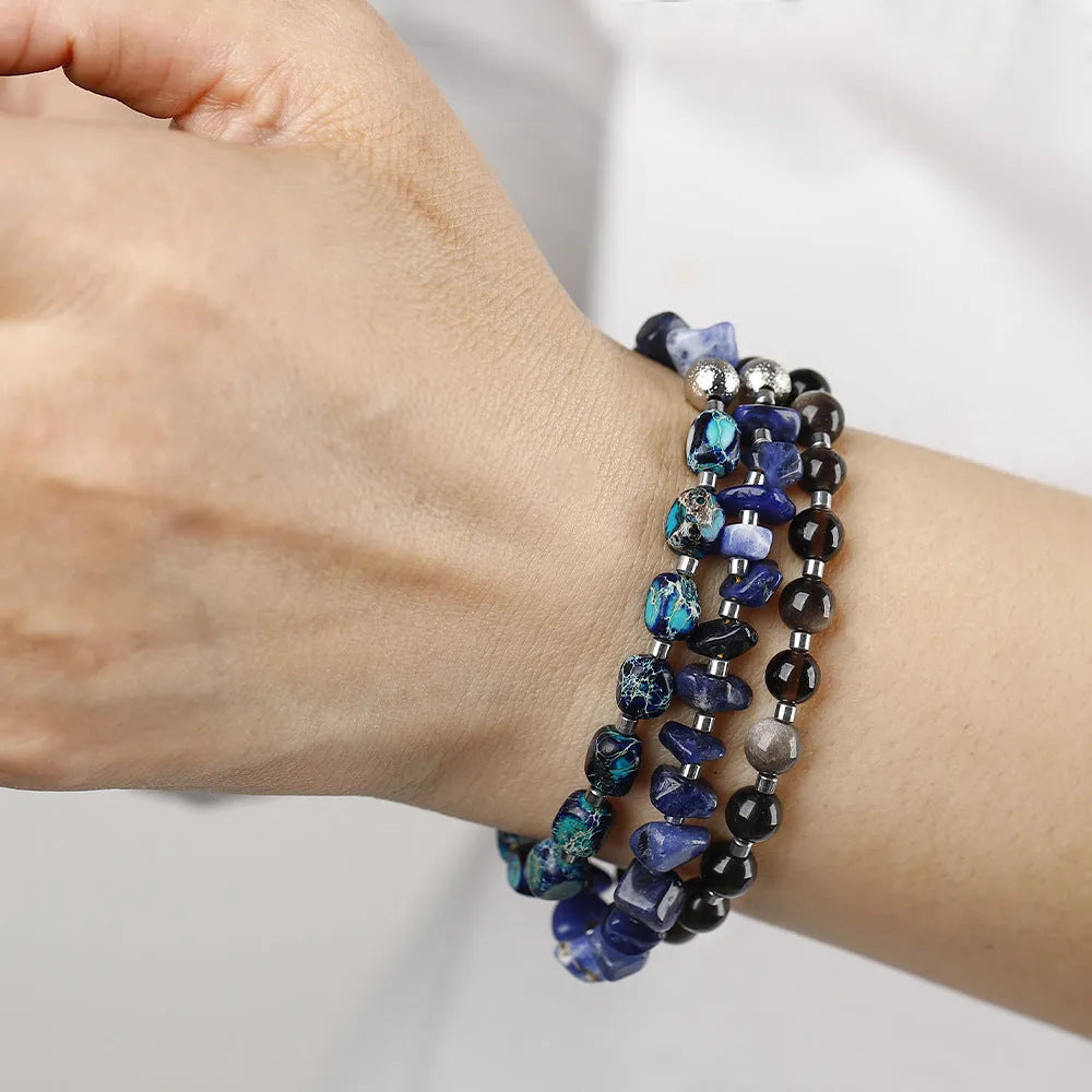 Blue hand-woven bracelet made from crushed Fang Hui stone and gold obsidian with geometric shapes