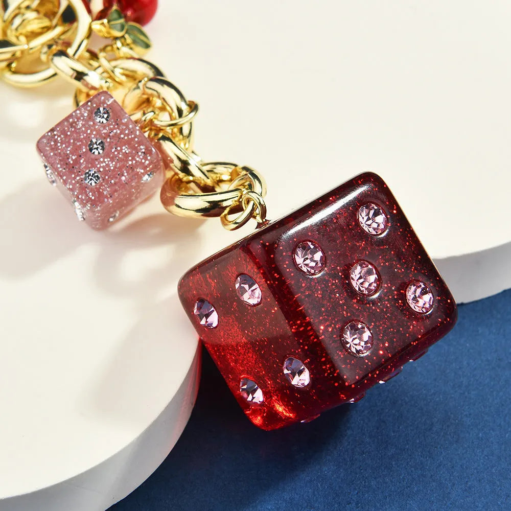 Vintage cherry red two-tone metal dice bag keychain pendant with a square geometric shape