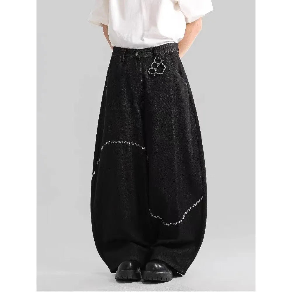 Black straight leg denim trousers with micro elastic waistband and zip fly placket detail