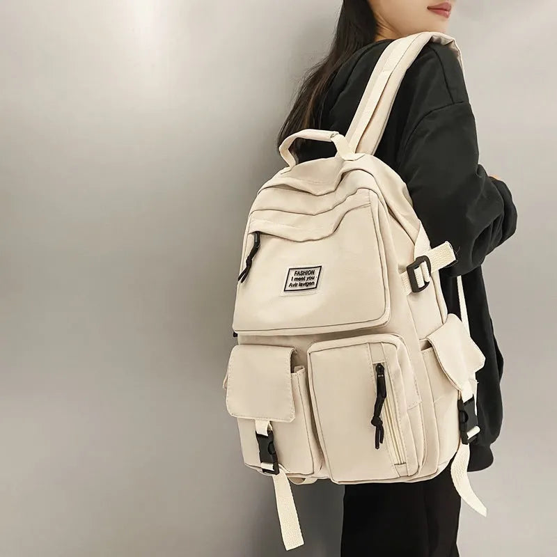 Soft nylon student backpack in black with three-dimensional pockets and laptop compartment