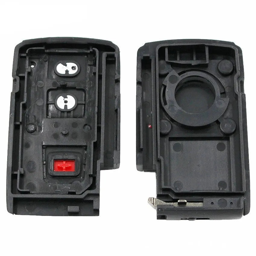 Black plastic car key shell replacement with small copper key blade measuring 70x38x20mm