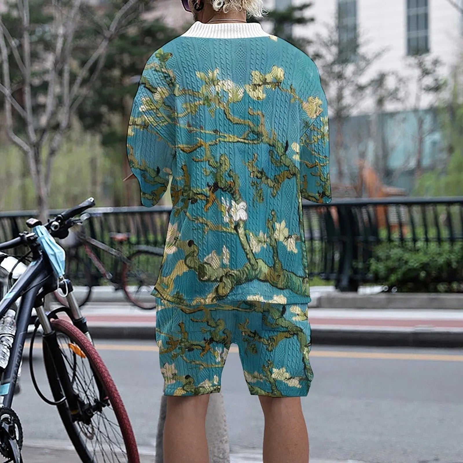 Peacock blue men's 3D printed knitted shorts suit with short-sleeve top on a mannequin