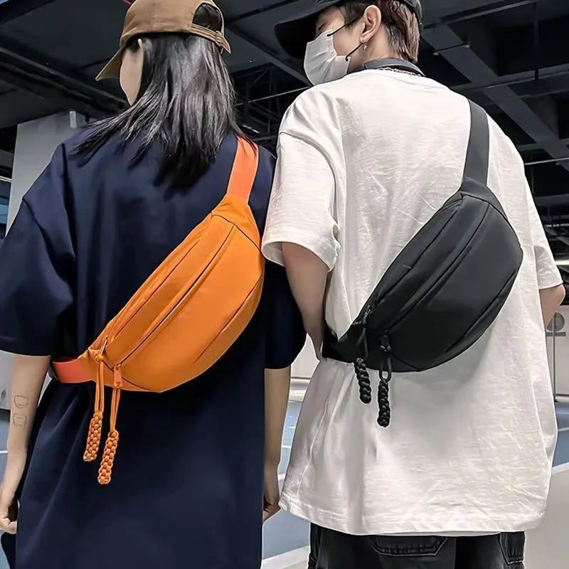 Men's adjustable crossbody bag in black showing compact dimensions and sport design