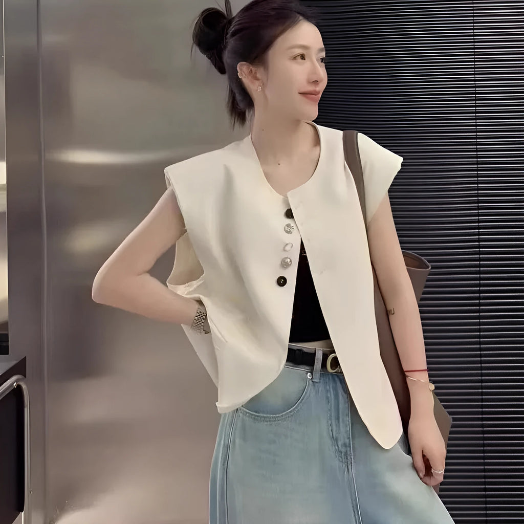 Women's loose fit vest with 40cm short length in milky white colour showing pocket detail