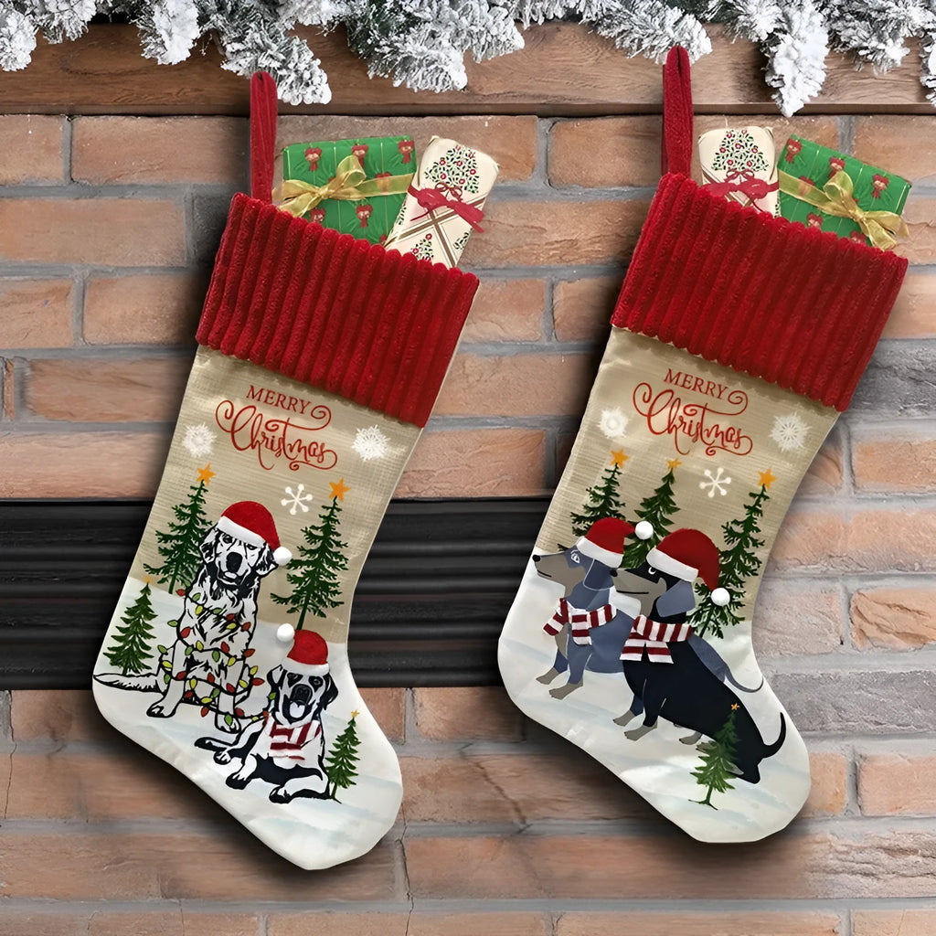Red and green cloth Christmas stocking pendant for pets, hanging on a tree branch.