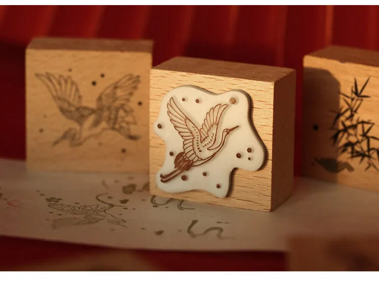 Wooden handled rubber stamp with hand-carved crane design for DIY paper crafting