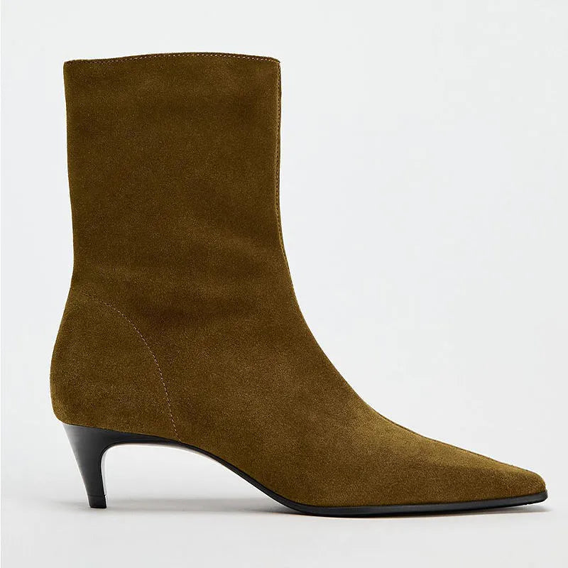 Brown square toe women's ankle boot with a side zip and a mid kitten heel on a plain background.