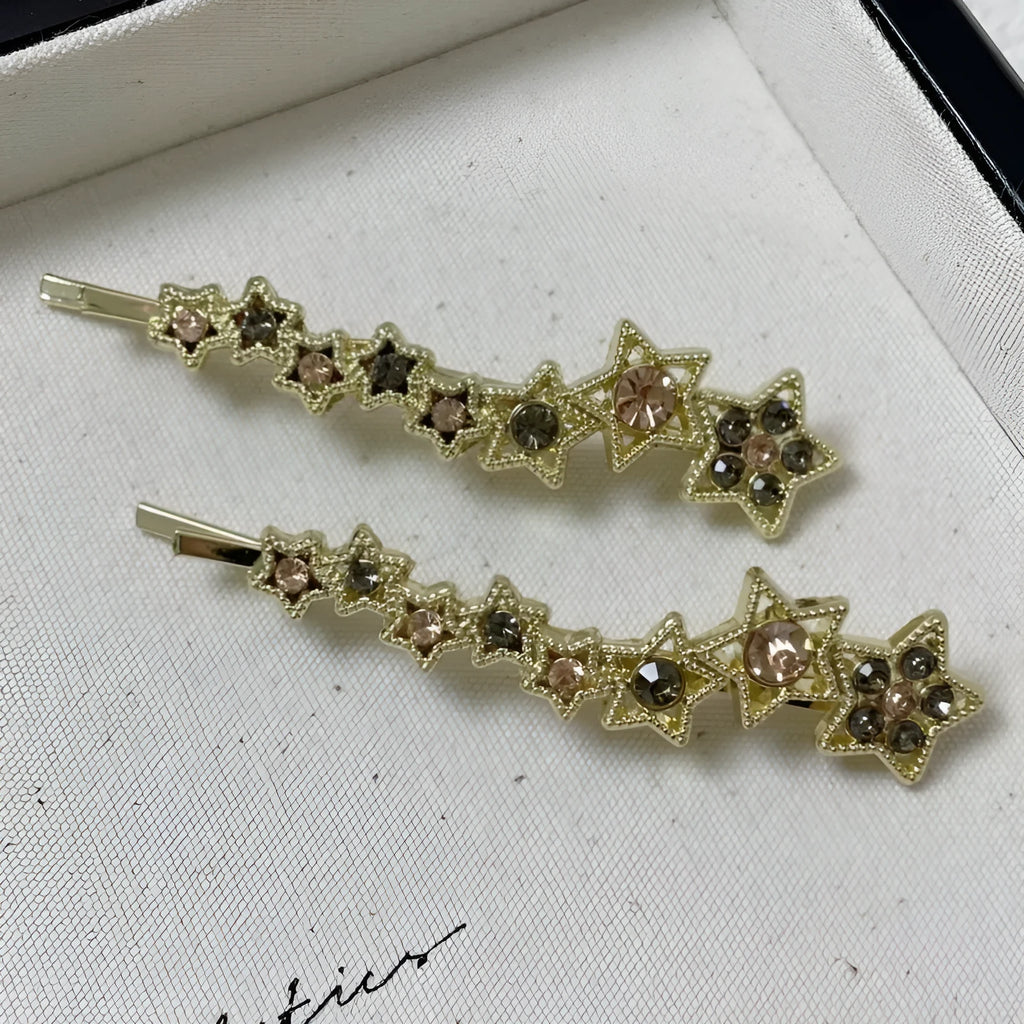Gold electroplated alloy hair barrette with side clip and five-pointed star charm decoration