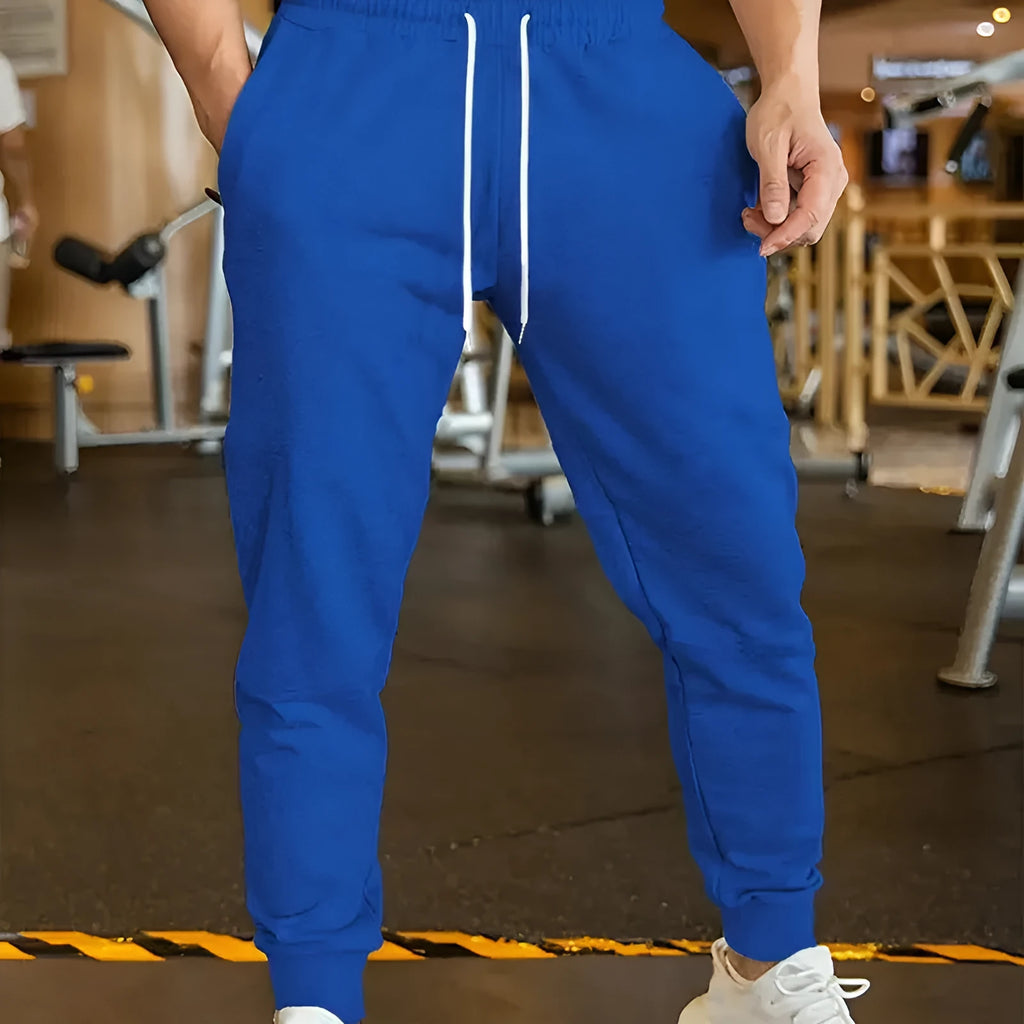 Men's linen-coloured leisure trousers with a loose fit and drawstring waist.