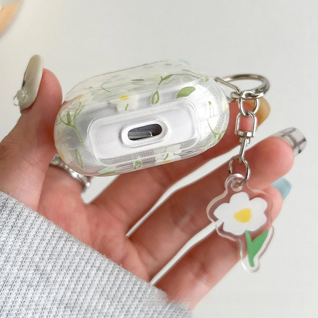 White floral pattern clear TPU protective case for Apple AirPods on a charging case.