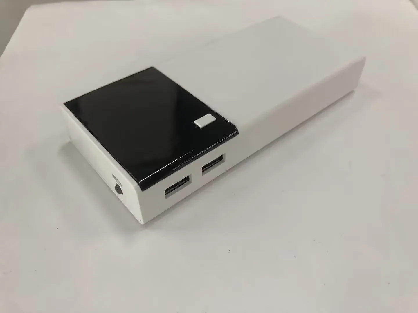Black 20000mAh power bank with aluminium shell 18650 batteries showing charging port