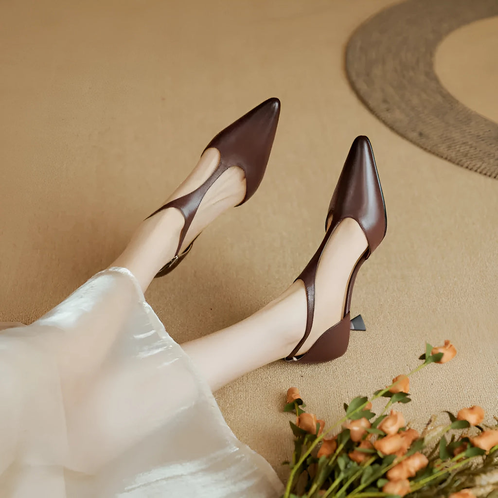 Brown and black women's pointed toe high heels made from cowhide leather.